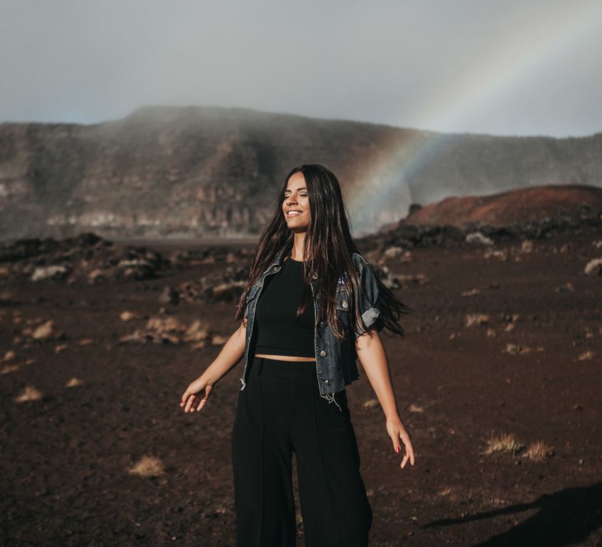 woman with rainbow geting-ready-for-planetary-new-year-Lions-Gate-Mercury-Retrograde-Stock-Photo-by-Candice-Picard