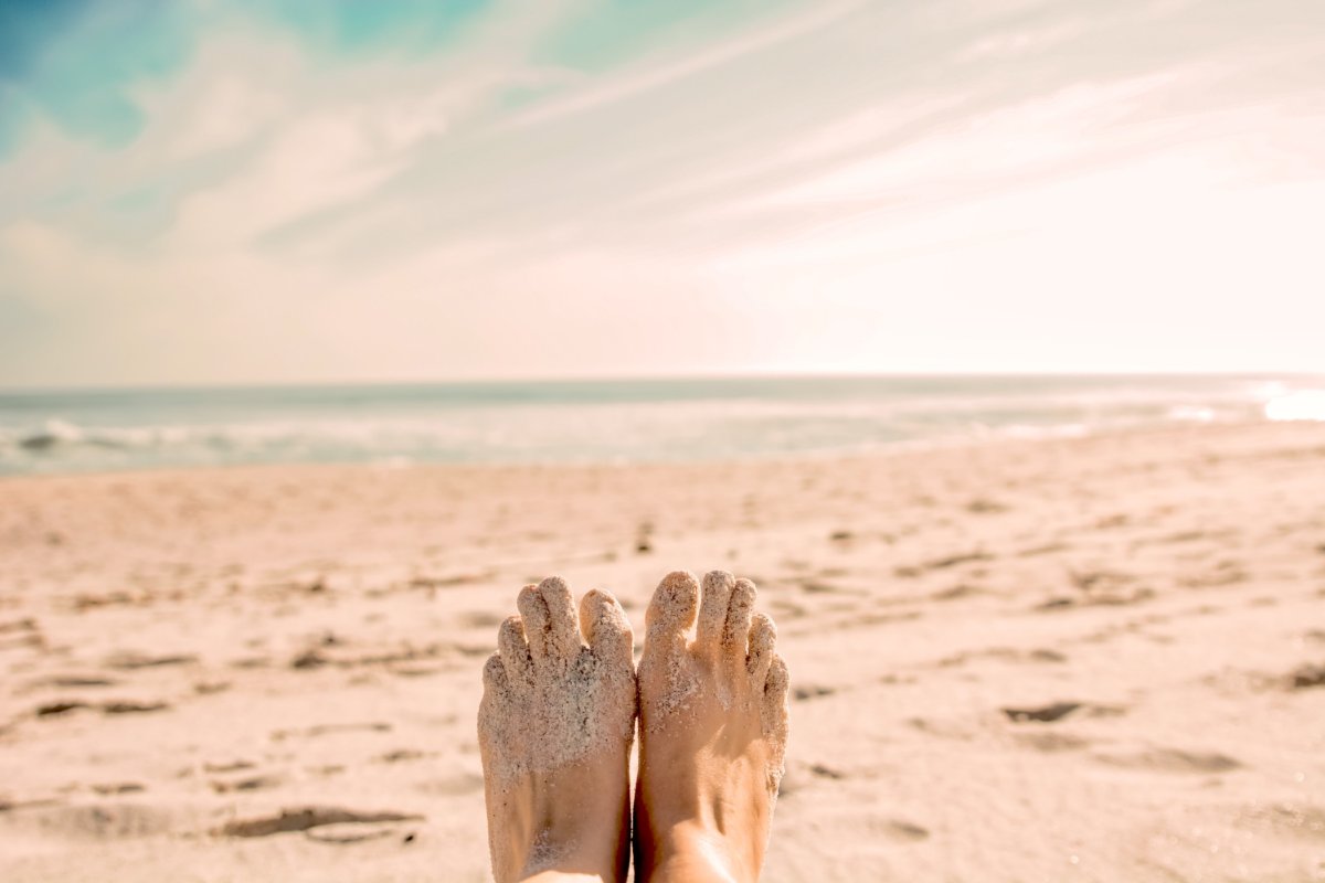 toe tapping at the beach to release energy and calm the mind